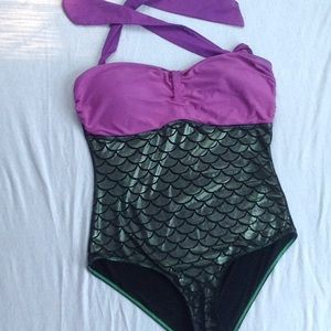 Woman's plus size woman's mermaid swim suite.